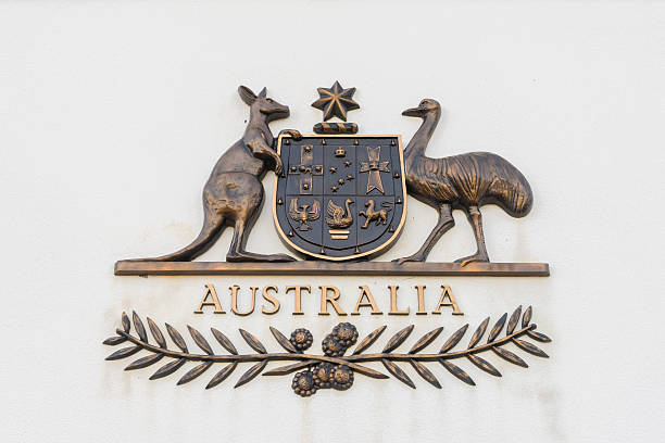 Canberra, Australia - June 28, 2016: View of The Commonwealth Coat of Arms, the formal symbol of the Commonwealth of Australia, in bronze outside the old Parliament House.