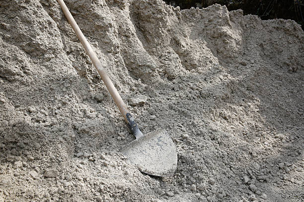 istock Shovel lying on a pile of construction material 589565536