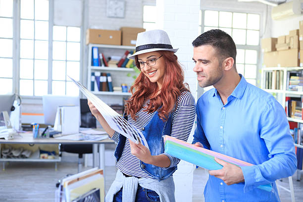 istock Team of graphic designers looking at color schemes 589565598