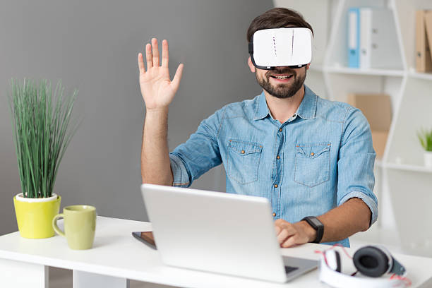 istock Positive man sitting at the table 589567404