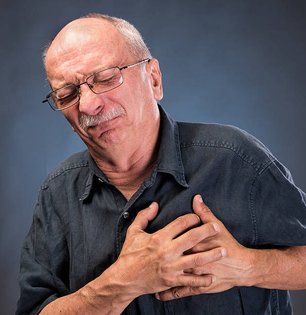 istock Man in glasses having a heart attack 589568226