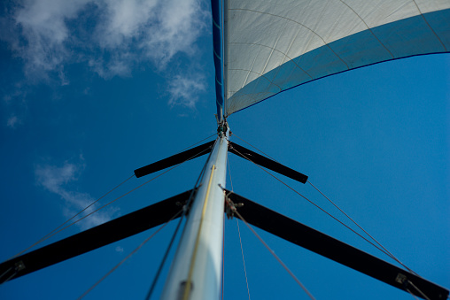 Raised sail and blue sky