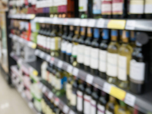 istock Wine bottles on shelf in wine store 589569080