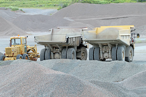 istock Earth Movers Parked In A Gravel Quarry, Rear View 589570242