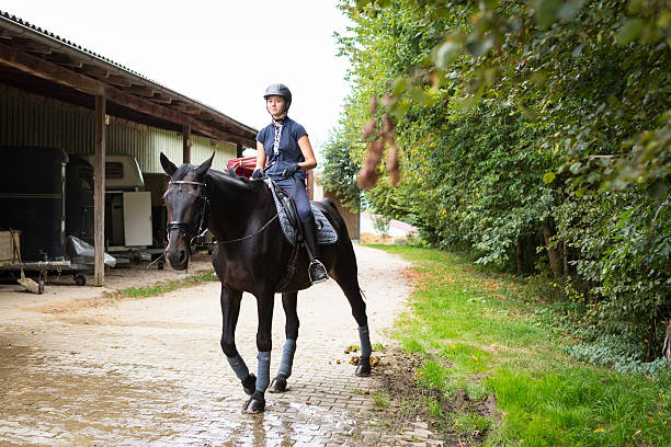 istock People and Horses on Horse Ranch 589572562