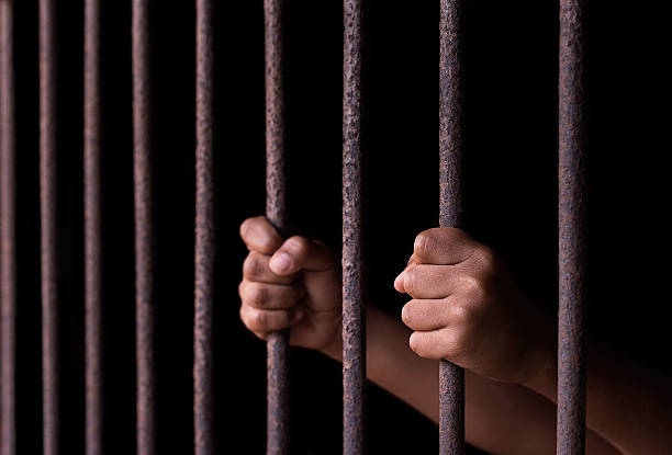 istock Boy hold cage with eye sad and hopeless 589573154