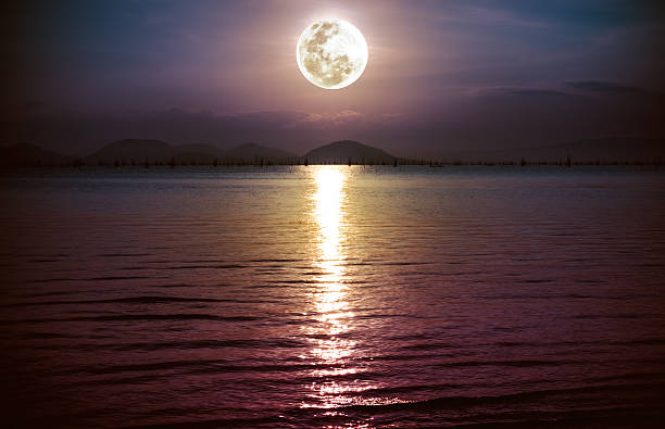 istock Romantic scenic with full moon on sea to night. 589573630