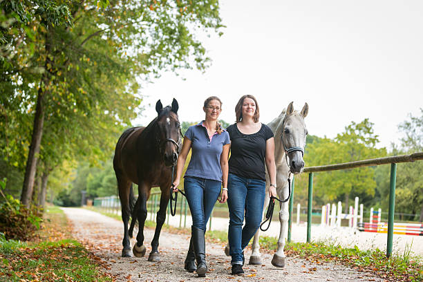 istock Friends With Their Horses 589573718
