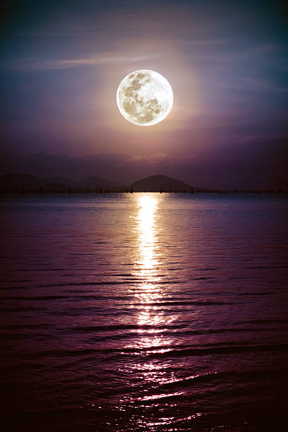 istock Romantic scenic with full moon on sea to night. 589574272
