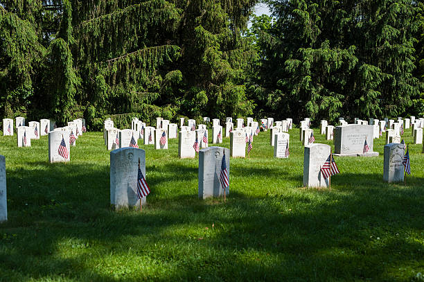 Memorial Flags Memorial Flags on grave sites gettysburg national cemetery stock pictures, royalty-free photos & images