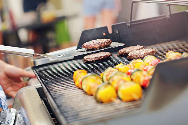 istock Grilled shashliks and hamburgers on grate 589578104