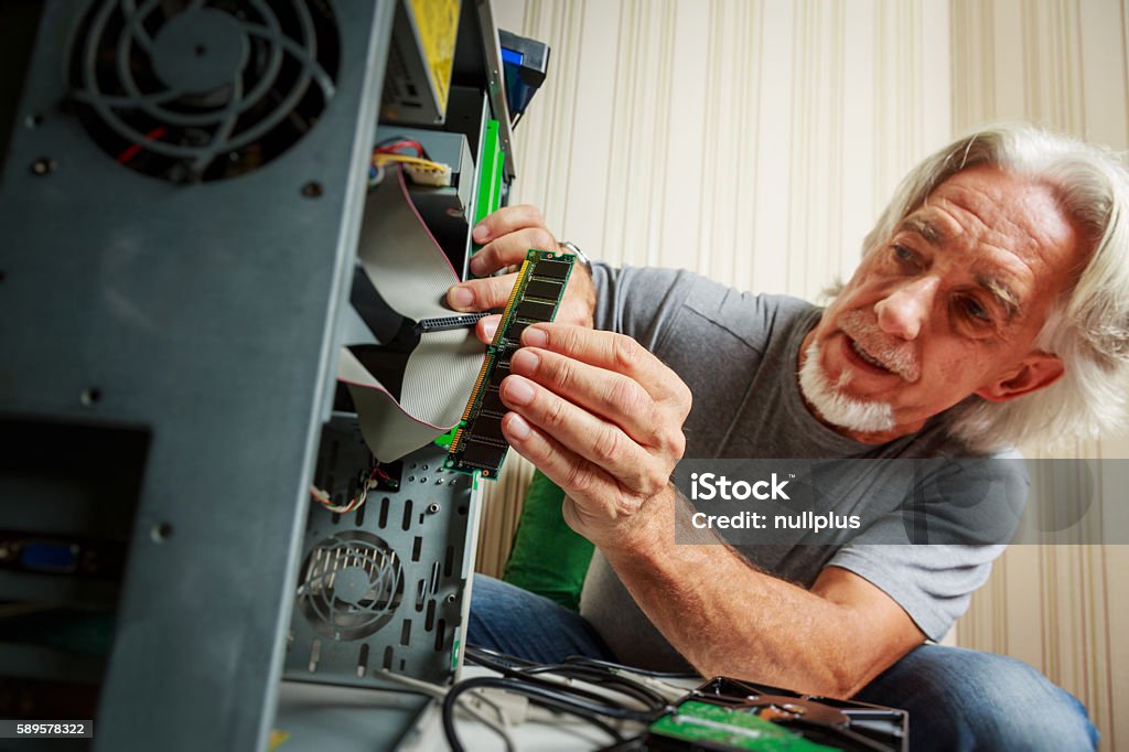 Man Installing Computer Senior Man Assembling A Desktop Computer Stock Photo - Download Image ...