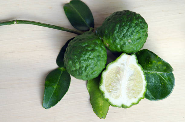 istock Bergamot fruit with leaf on wooden board 589578830
