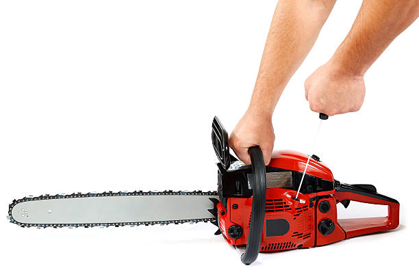 istock Gasoline chain saw in hand on a white background. 589578870