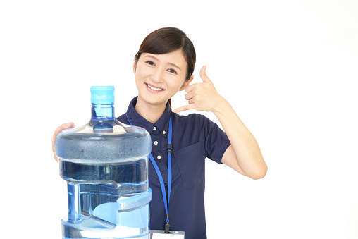 Smiling female worker isolated on white background