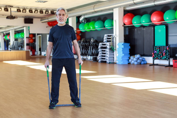 istock Senior Caucasian Man Working Out at the Gym 589581028