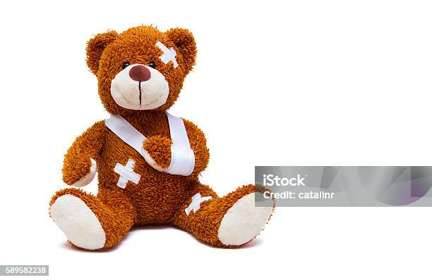 Injured Teddy Bear On White Background Stock Photo - Download Image Now - Adhesive Bandage, Child, Teddy Bear