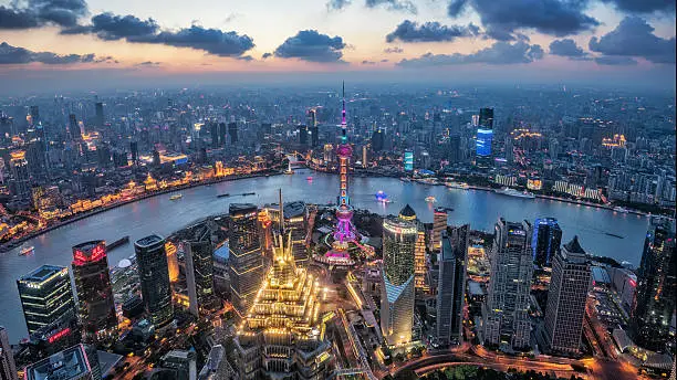 Shanghai, China cityscape overlooking the Financial District and Huangpu River.