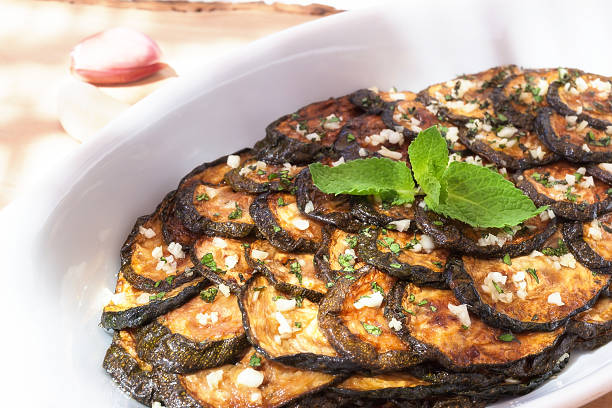 istock Zucchini scapece. Fried zucchini flavored vinegar and mint. 589582574