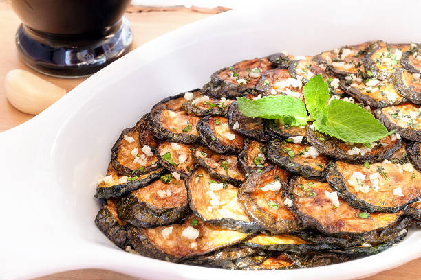istock Zucchini scapece. Fried zucchini flavored vinegar and mint. 589582730