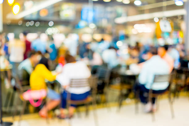 istock Abstract blur people in food center 589583770