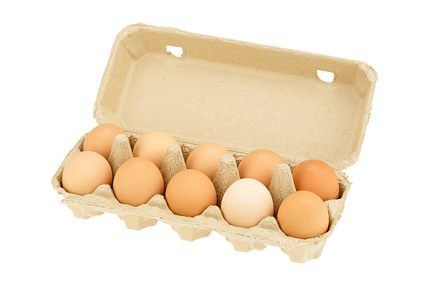 istock Eggs with carton box isolated on white background. 589583782