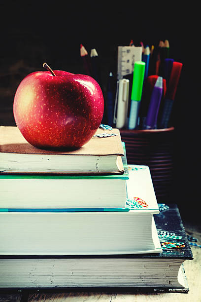 istock School books on wooden background 589583804