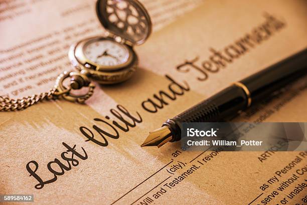 Fountain Pen Pocket Watch On A Last Will And Testament Stock Photo - Download Image Now