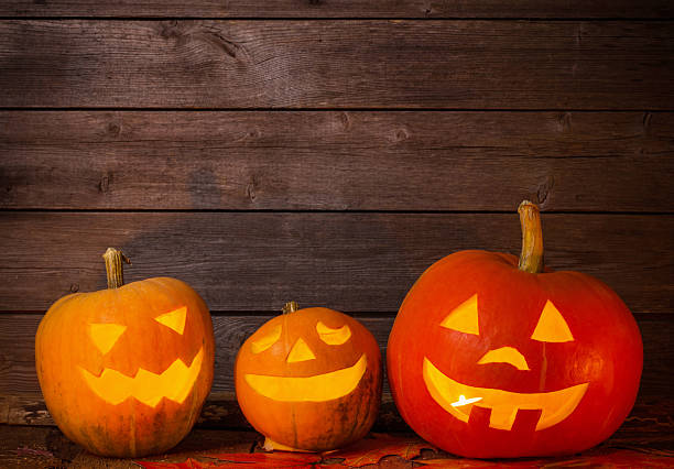 istock pumpkins on wooden background with copy space 589584338