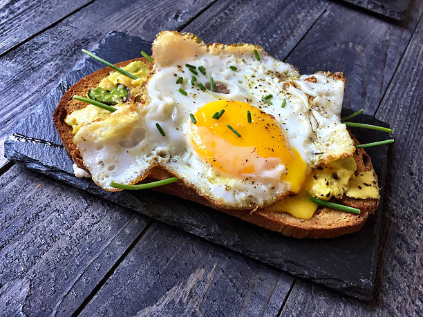 istock Delicious Tasty Avocado Eggs and Tomato Cheese Toasts 589585128