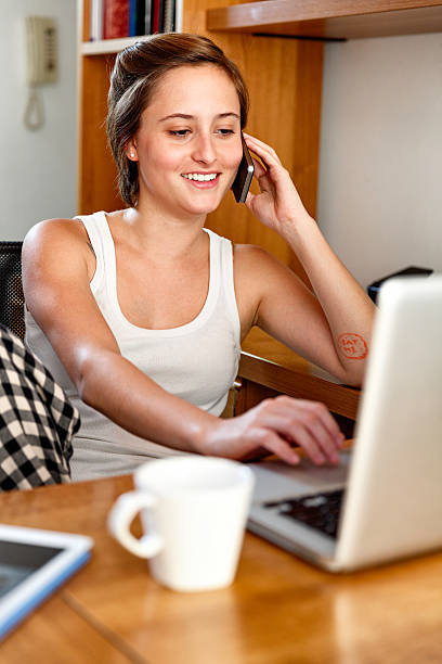 istock Freelancer gender fluidIty young woman working in home studio. 589938700