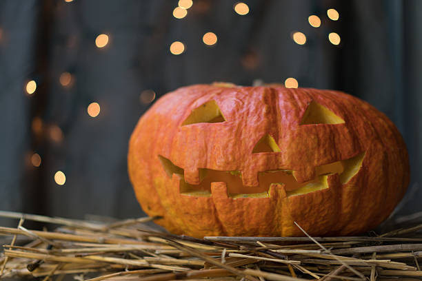 istock Halloween pumpkin on a gray background 589938964