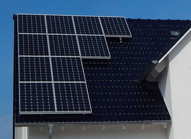 istock Black tile roof with solar panels 589939446