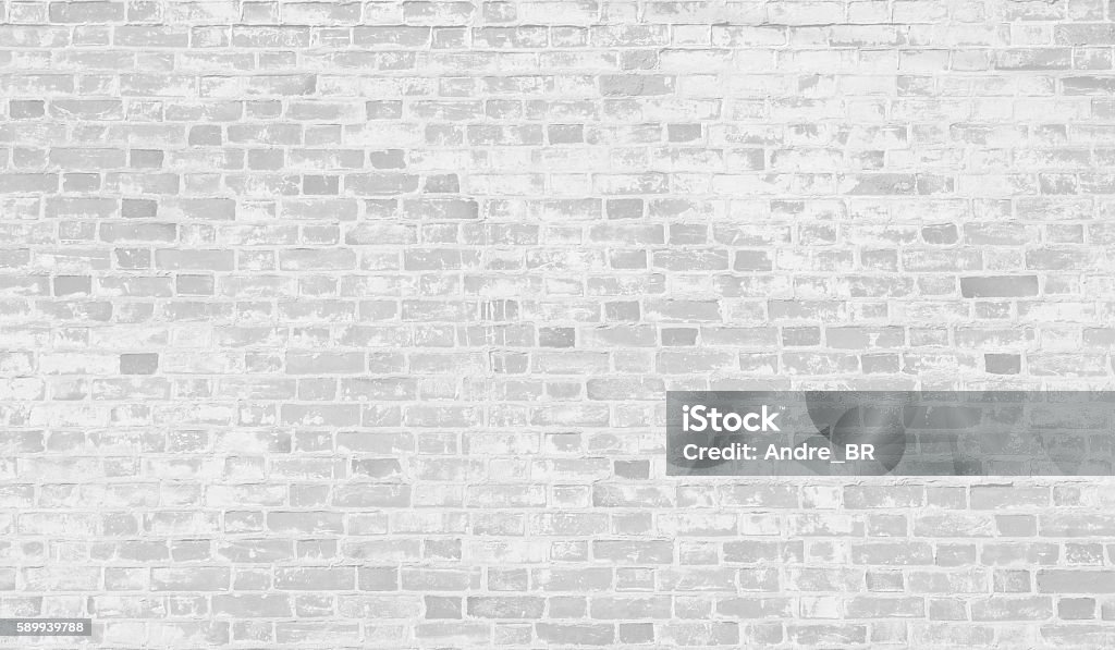 Faded white brick wall background. Faded white brick wall background with copy space. Brick Stock Photo
