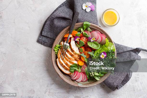 Spring Salad With Vegetables Chicken Breast And Edible Flowe Stock Photo - Download Image Now