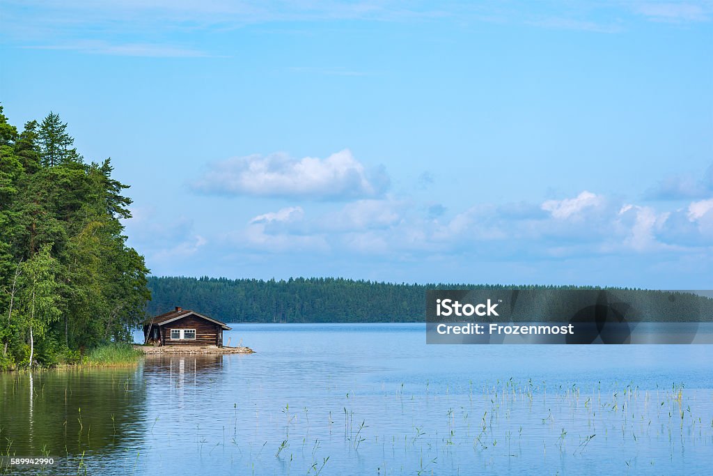 Cabin and lake Small sauna cabin in the shore of lake in eastern Finland Finland Stock Photo