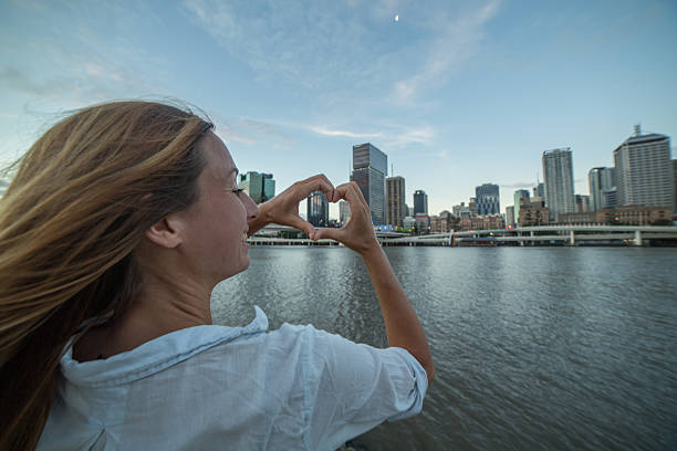 istock Young woman loving Brisbane, Australia 589945180