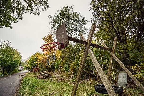 A basketball hoop with a backboard against a blue sky