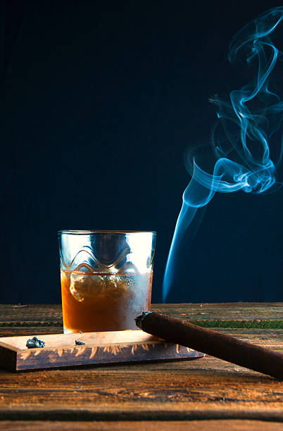 istock Whisky with ice and cigar on wooden table 589946742