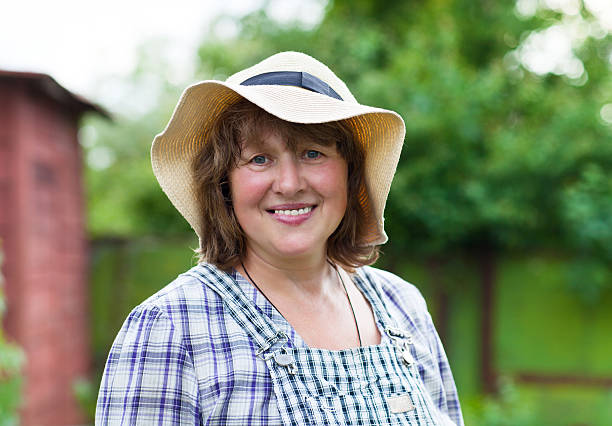 istock Middle age woman in hat working 589947828