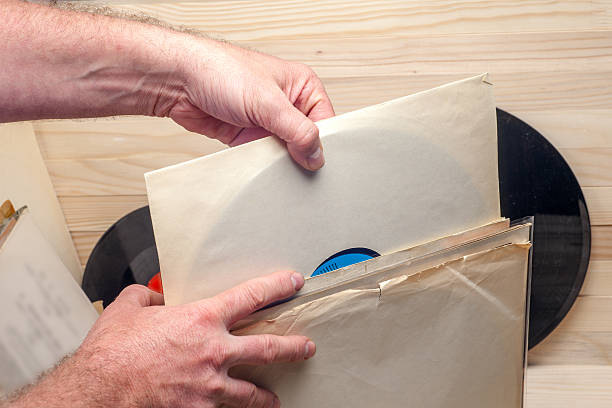 istock Browsing through vinyl records collection. Music background. Copy space 589949492