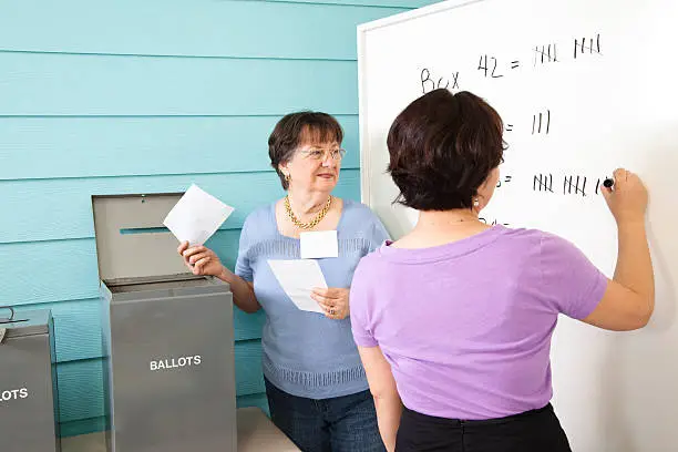 Photo of Volunteers counting ballots in the November United States elections.