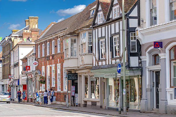 Farnham/UK. 13th August 2016. Shops and retail facilities in a historic central Farnham Street attract day trippers on a warm summer's day. Unidentified people.