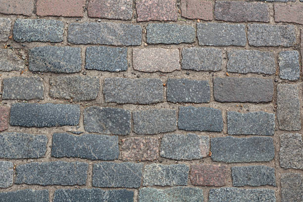 Natural stone cobbles laid in stright pattern stock photo