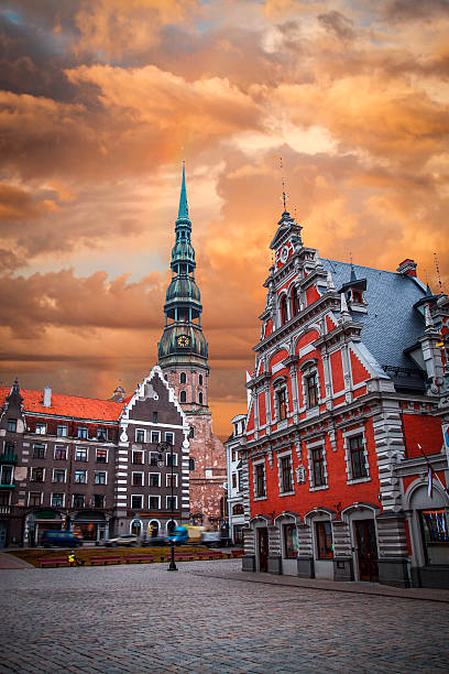 City Hall Square City Hall Square with House of the Blackheads and Saint Peter church in Old Town of Riga in the evening, Latvia latvia stock pictures, royalty-free photos & images