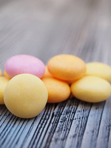 istock Colorful candy on wooden background 589953240
