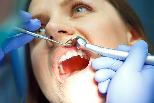 istock Woman getting a dental treatment 589955082