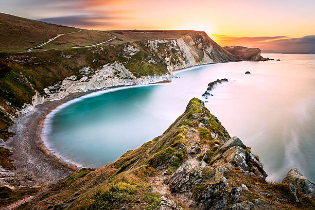 Durdle Door Sunset at Durdle Door, Dorset, UK jurassic coast world heritage site stock pictures, royalty-free photos & images