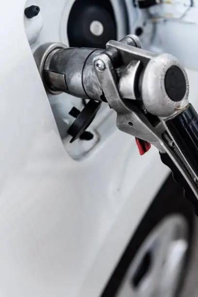 car connected fuel pump nozzle or LPG gas dispenser