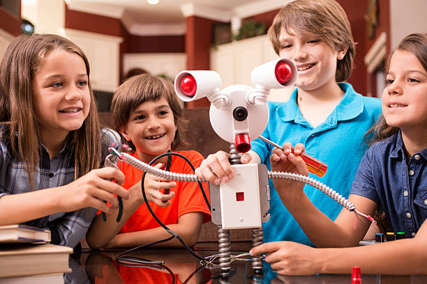 istock Children build robot together at home. 589961900